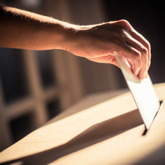 Conceptual image of a person voting during elections