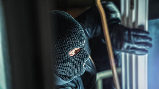 masked burglars breaking and entering into a victim's home