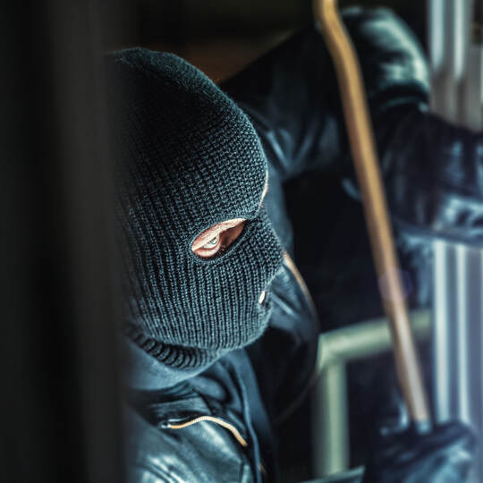 masked burglars breaking and entering into a victim's home
