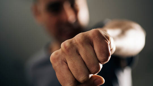 young man throwing a punch