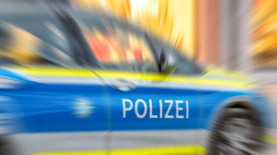 Motion blur of German police car with letters POLIZEI.