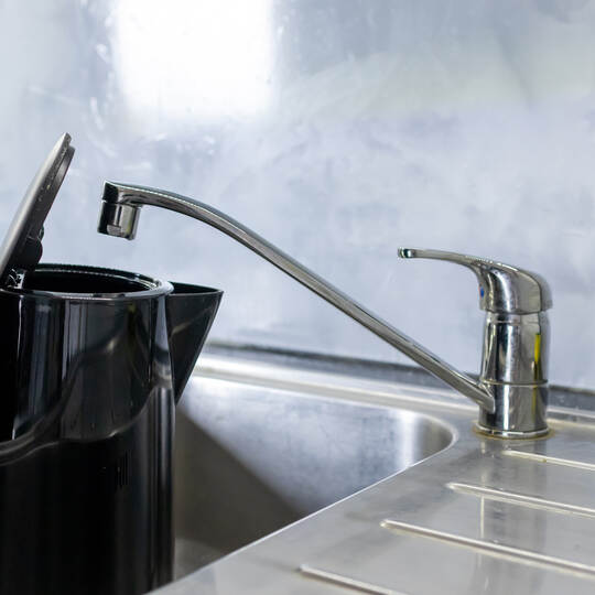 Electric kettle filling with tap water from kitchen sink, Daily water boiling preparation process