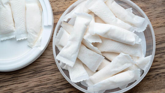 Box of swedish nicotine , snus on wood background