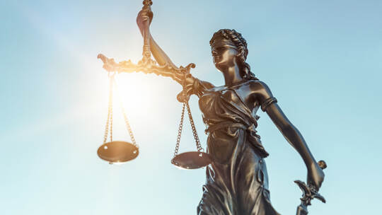 Lady justice. Statue of Justice on sky background