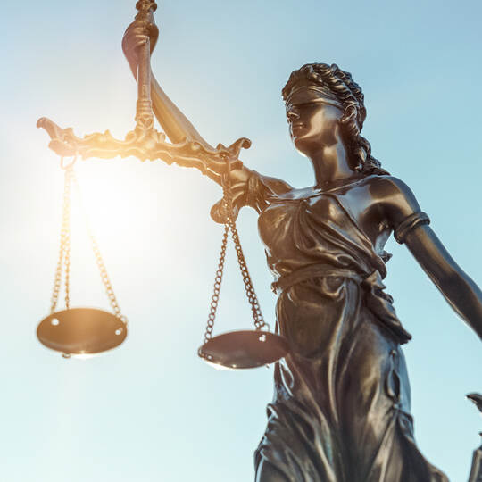 Lady justice. Statue of Justice on sky background