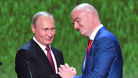 Wladimir Putin und Gianni Infantino