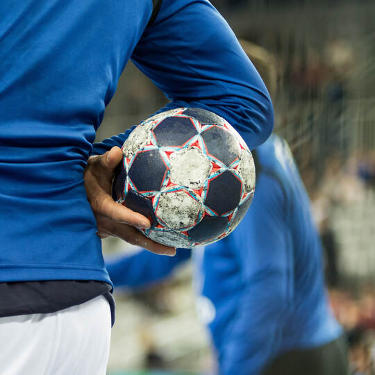 Player holding the ball, close up