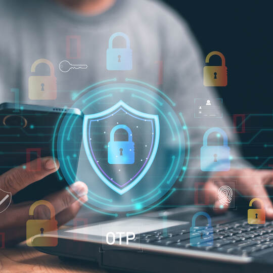 Cybersecurity and digital privacy. Person use smartphone and laptop with virtual shield, padlock icons. OTP authentication, data