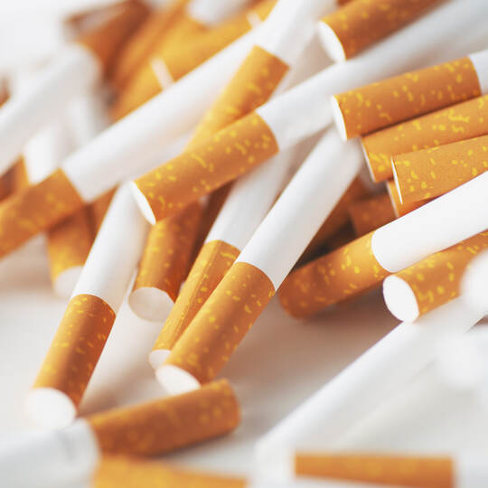 Close up of a smoking cigarettes . cigarette filter tubes