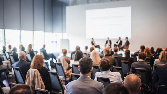 Interview and round table discussion at business convention and presentation. Audience at the conference hall. Business and entr