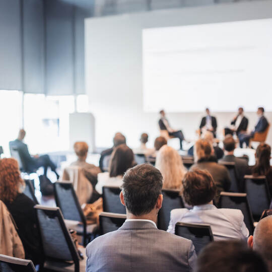 Interview and round table discussion at business convention and presentation. Audience at the conference hall. Business and entr