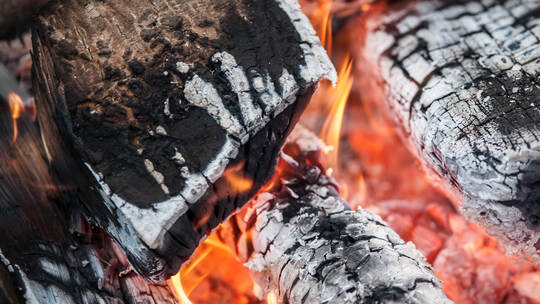 Abstract close-up detail view of fire burning wood