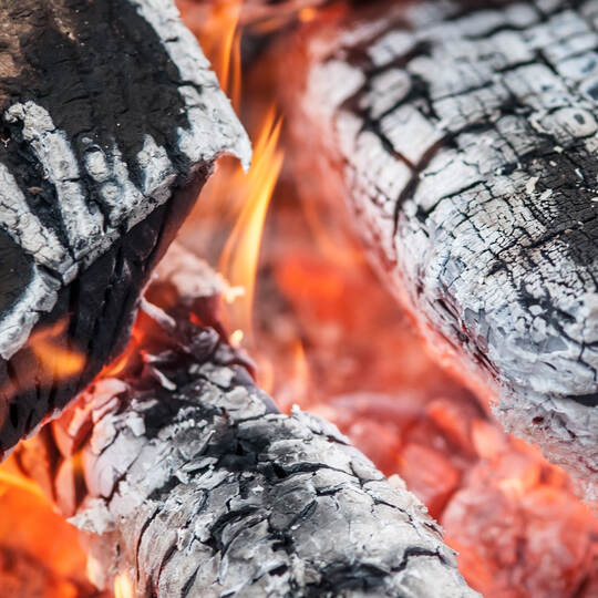 Abstract close-up detail view of fire burning wood