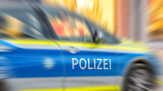 Motion blur of German police car with letters POLIZEI.