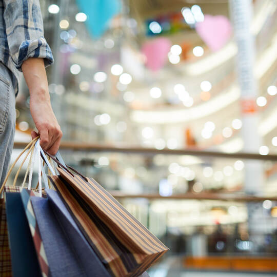 Holding many shopping bags