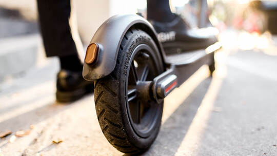 Electric scooter on the road. close up