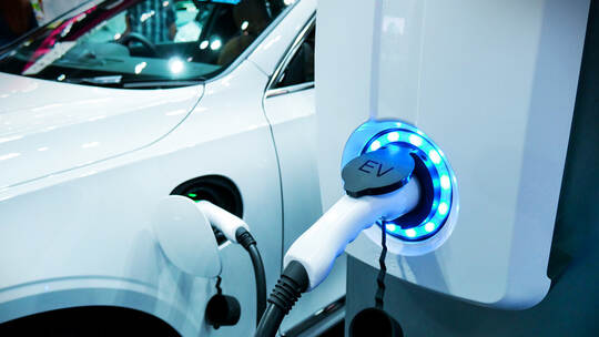 Power supply connect to electric vehicle for charge to the battery. Charging technology industry transport which are the futuris