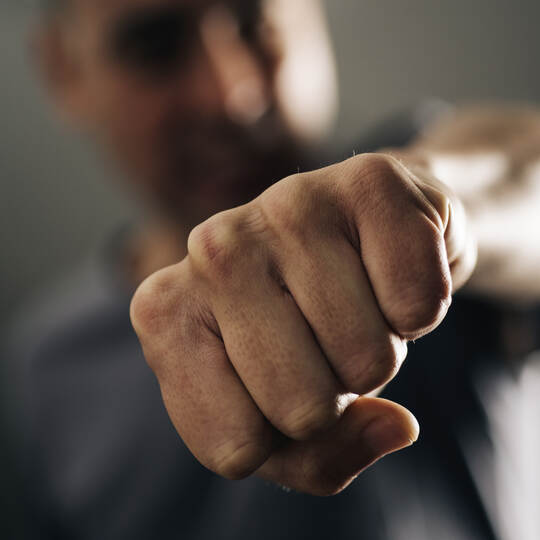 young man throwing a punch