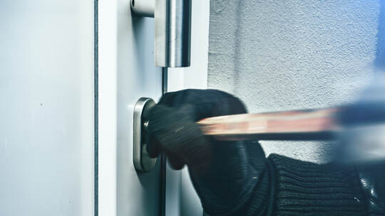 masked burglars breaking and entering into a victim's home