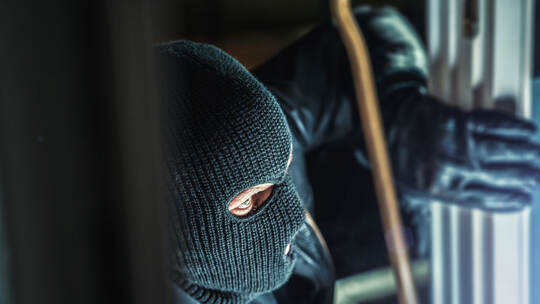 masked burglars breaking and entering into a victim's home