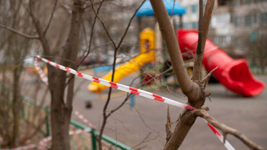 a playground fenced with warning tape.