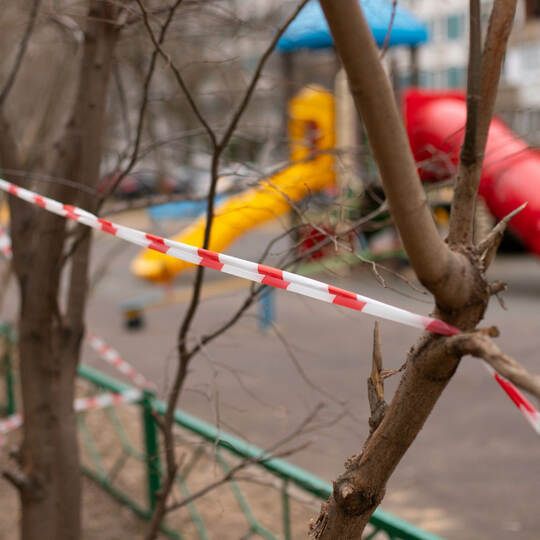 a playground fenced with warning tape.