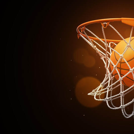 3d rendering of a basketball in the net on a dark background.