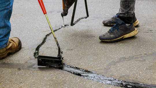 Asphalt road with filled cracks repair, liquid, of the fix road