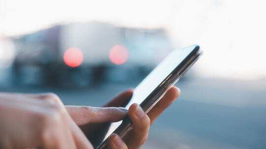 Social media marketing concept. Women hand using smartphone typing, chatting conversation in chat box icons pop up