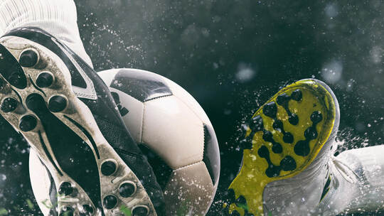 Football scene at night match with close up of a soccer shoe hitting the ball with power