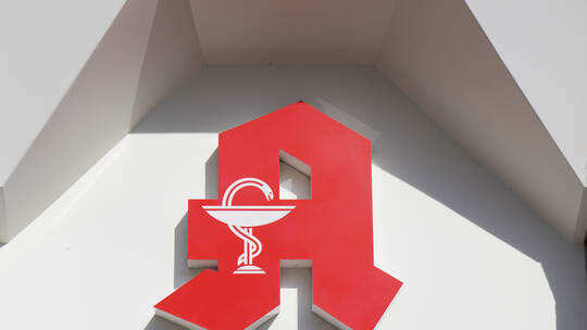 German Apotheke - which translates as pharmacy or drugstore - with red A logo sign in Hannover, Germany on March 16, 2020