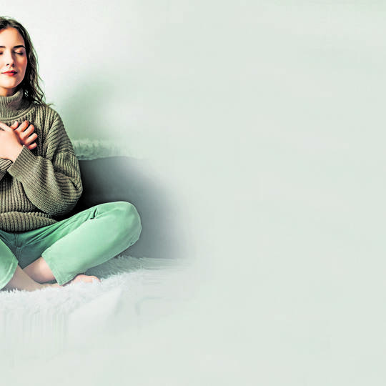 Relaxation techniques: Woman practicing pranayama in lotus position on bed, breathing exercises to reduce stress and anxiety, ac
