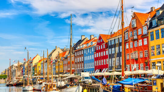 Copenhagen iconic view. Famous old Nyhavn port in the center of Copenhagen, Denmark during summer sunny day