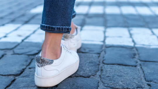legs at a pedestrian crossing